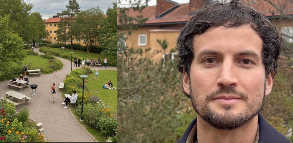 En park med gångstig i mitten, gröna gräsmattor och folk som sitter på bänkar och filtar. Till häger en man med mörkt kort hår, skägg och en mörk jacka.