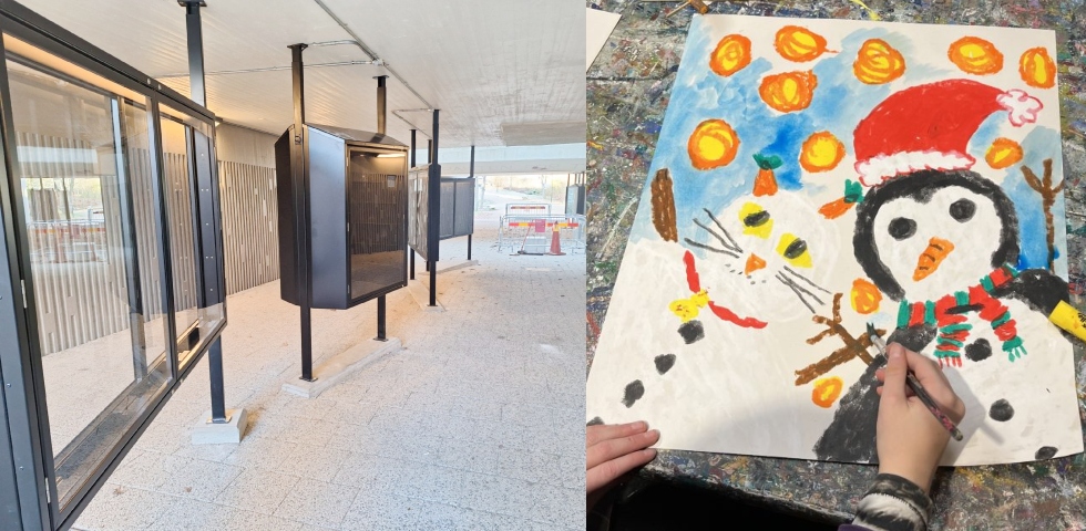 En tunnel med ljusa betongväggar och i mitten stora svarta glasmontrar.