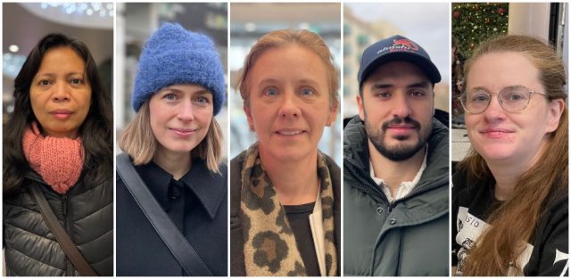 Fem personer som står i ett shopingcentrum